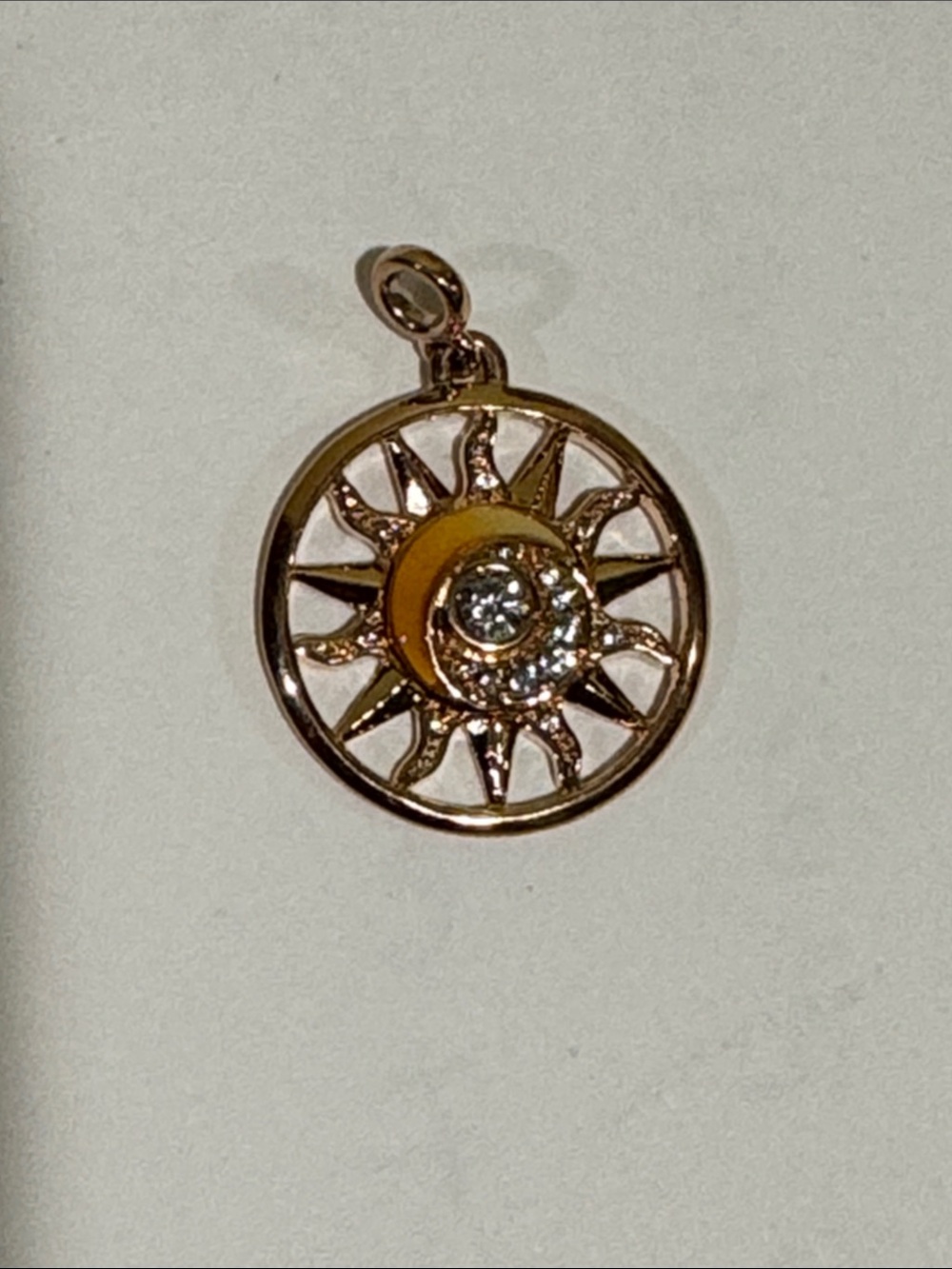 New pandora CZ 14k rose gold plated sun medallion.